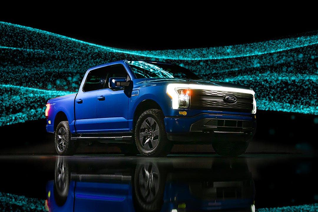 blue Ford-150 Lightning against sparkly background