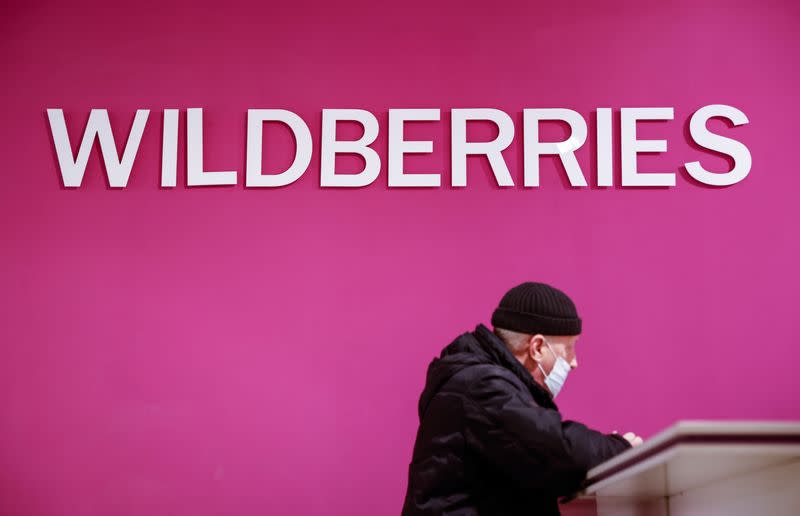 Customer waits for his package at a pickup point of Wildberries online retailer in Moscow