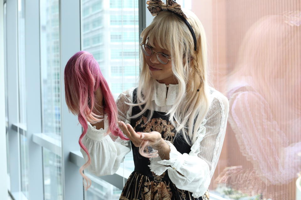 Kerraine, 36, posing with one of the wigs she bought from Taiwanese brand Dream Holic. (Photo: Nurul Azliah/ Yahoo Lifestyle Singapore)