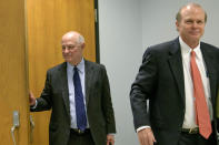 Edward Dirk Wegmann, attorney for the New Orleans Archdiocese, right, and James C. Gulotta, Jr., attorney for the New Orleans Saints, leave a hearing at Orleans Parish Civil District Court in New Orleans, Thursday, Feb. 20, 2020. The New Orleans Saints headed to court Thursday in a bid to block the release of hundreds of confidential emails detailing the behind-the-scenes public relations work the team did for the area's Roman Catholic archdiocese amid its sexual abuse crisis. The request comes amid claims that the NFL team joined the Archdiocese of New Orleans in a “pattern and practice” of concealing sexual abuse — an allegation the Saints have vehemently denied. (AP Photo/Matthew Hinton)