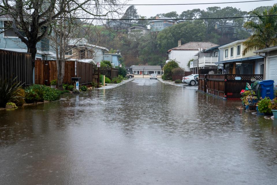 Streets are flooded during a storm in Rio Del Mar, California (EPA)