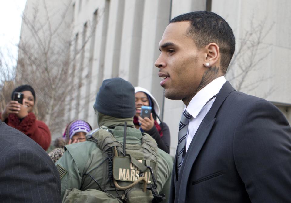 Singer Chris Brown, leaves the District of Columbia Superior Court in Washington, Wednesday, Jan. 8, 2014. Lawyers for Brown say the singer has rejected a plea deal in a case in which he’s accused of hitting a man outside a Washington hotel. Brown appeared Wednesday afternoon in a D.C. court. He and his bodyguard face a misdemeanor assault charge after an incident in October outside the W Hotel. (AP Photo/Manuel Balce Ceneta)