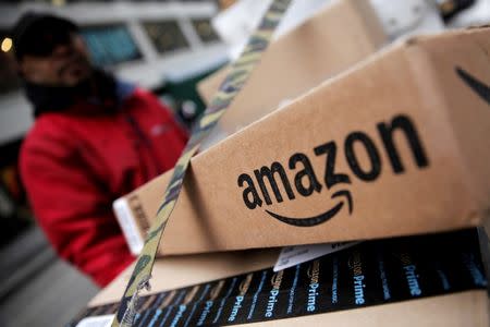 Amazon boxes are seen stacked for delivery in Manhattan, New York, U.S., January 29, 2016. REUTERS/Mike Segar/Files