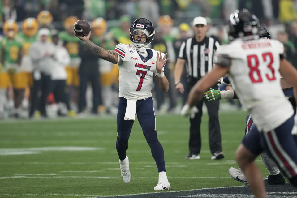 Liberty quarterback Kaidon Salter (7) throws during the first half on the NCAA Fiesta Bowl college football game against Oregon, Monday, Jan. 1, 2024, in Glendale, Ariz. (AP Photo/Ross D. Franklin)