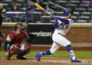 New York Mets' Francisco Lindor follows through on a double against the Arizona Diamondbacks during the fifth inning of a baseball game Saturday, May 8, 2021, in New York. (AP Photo/Noah K. Murray)