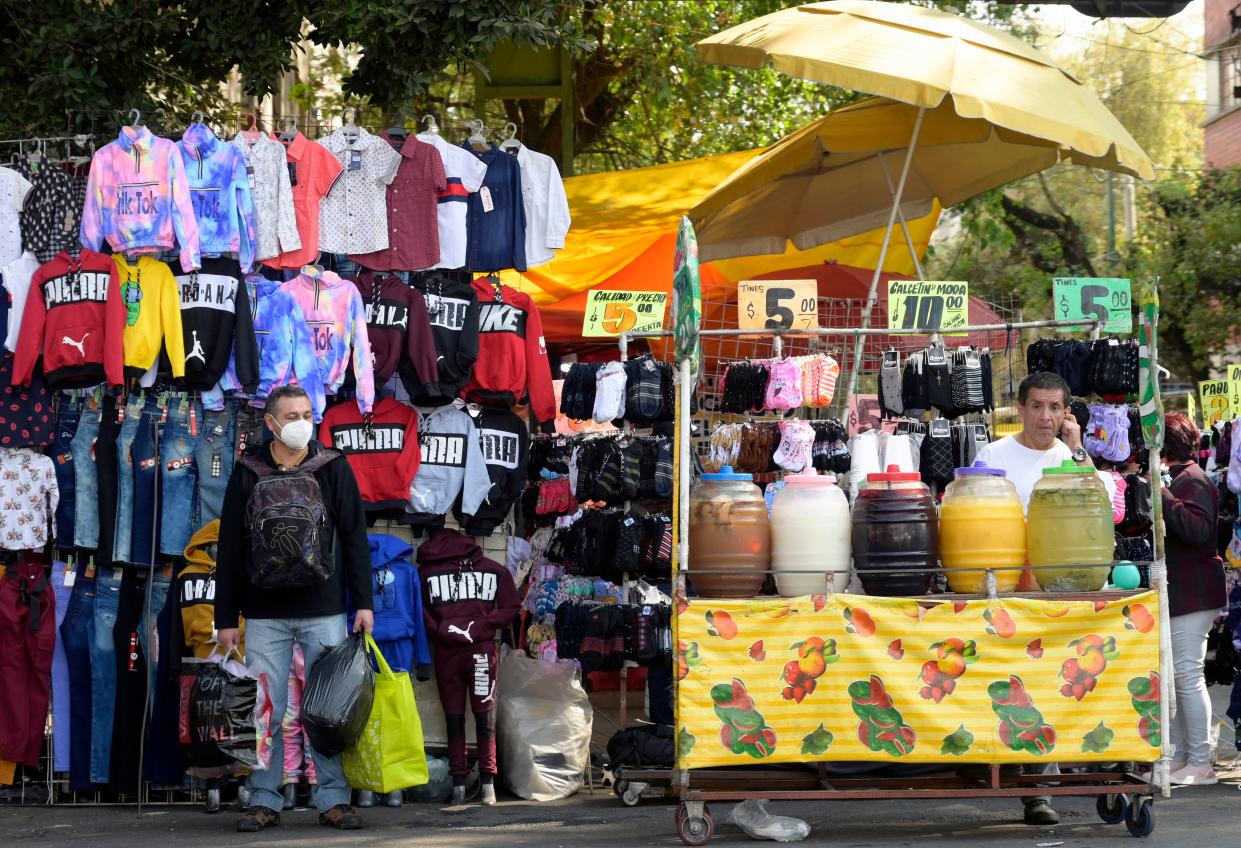 A street vendor offers flavored waters at the start of the Christmas season in Mexico City on December 1, 2020, amid the COVID-19 coronavirus pandemic. - Mexico City's government reported that the orange alert is still on due to the high number of COVID-19 infections that have been registered in the city. (Photo by ALFREDO ESTRELLA / AFP) (Photo by ALFREDO ESTRELLA/AFP via Getty Images)