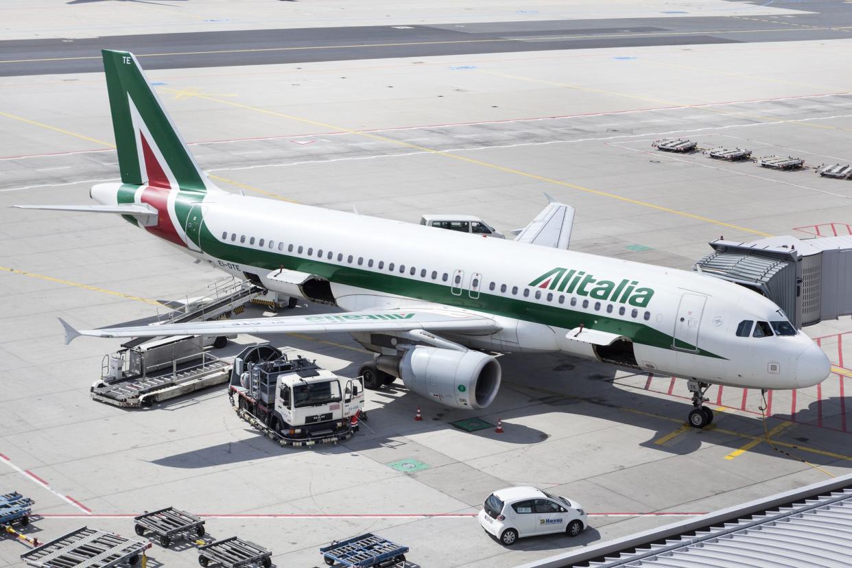 An Airbus A320 of Italian Airline Alitalia is being prepared for flight at Frankfurt Airport