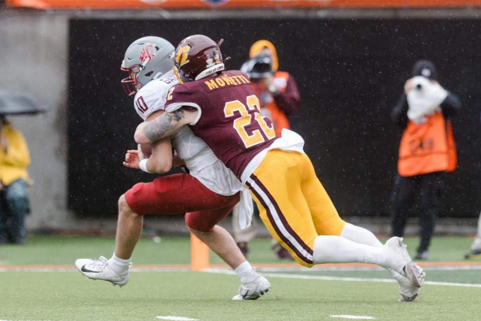 Central Michigan's Kyle Moretti (22) and Washington State's Victor Gabalis (10) at the 88th Tony the Tiger Sun Bowl at Sun Bowl Stadium in El Paso, Texas, on Friday, Dec. 31, 2021.