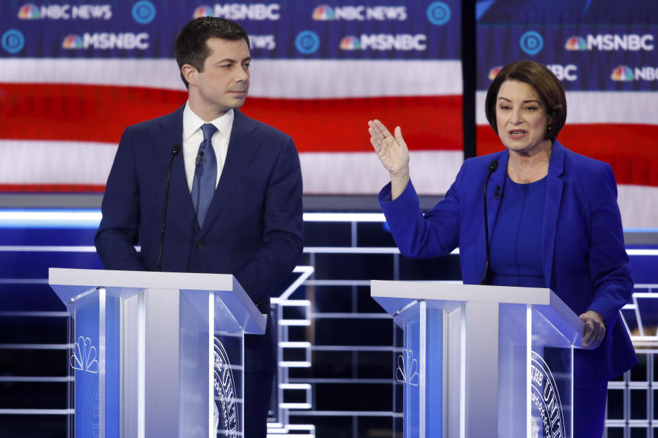 Democratic presidential candidates former South Bend Mayor Pete Buttigieg, left, looks on as Sen. Amy Klobuchar, D-Minn., speaks during a Democratic presidential primary debate Wednesday, Feb. 19, 2020, in Las Vegas, hosted by NBC News and MSNBC. (AP Photo/John Locher)