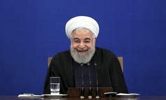 Iran's President Hassan Rouhani smiles