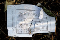 FILE PHOTO: A page of a flight crew operations manual is seen at the scene of the Ethiopian Airlines Flight ET 302 plane crash, near the town of Bishoftu, near Addis Ababa, Ethiopia March 12, 2019. REUTERS/Baz Ratner