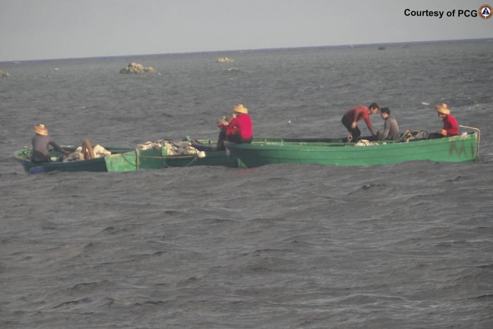 In this June 12, 2016 handout photo provided by the Philippine Coast Guard, suspected Chinese maritime militia transport giant clams which they got in the Scarborough shoal at the disputed South China Sea, the Philippine Coast Guard said. The Philippines blamed Chinese fishermen on Monday May 20, 2024 for the massive loss of giant clams in a disputed shoal fiercely guarded by Beijing's coast guard in the South China Sea and demanded an international inquiry to determine the extent of environmental damage in the far-flung fishing atoll. (Philippine Coast Guard via AP)