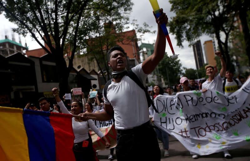 A protester reacts in the street where Dilan Cruz was injured, allegedly by a tear gas canister fired by riot police during the national strike on the previous day, in Bogota