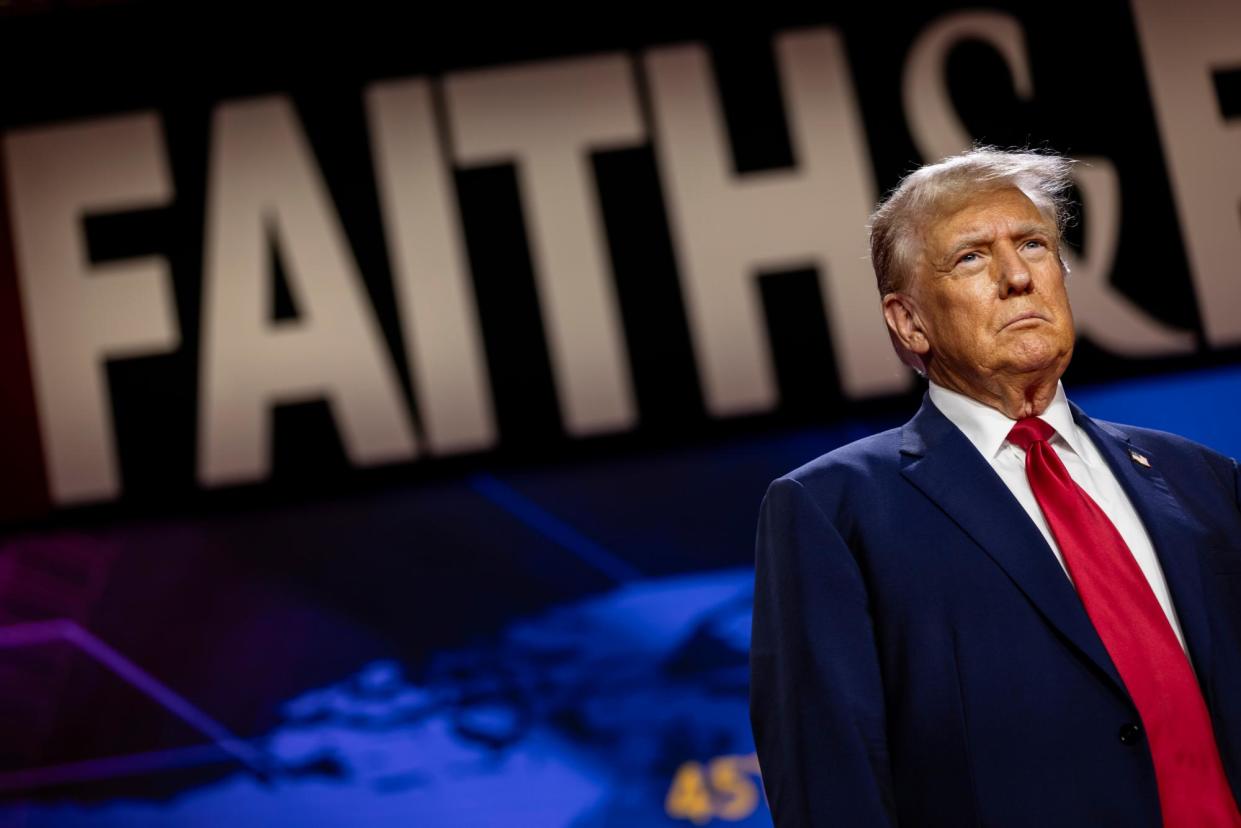 <span>Donald Trump arrives at a ‘faith and freedom’ conference in Washington DC on 22 June 2024.</span><span>Photograph: Samuel Corum/Getty Images</span>