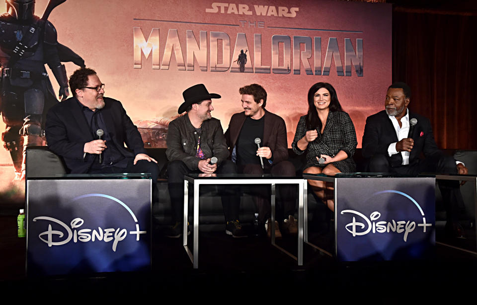 WEST HOLLYWOOD, CALIFORNIA - OCTOBER 19:  (L-R) Executive producers/writers Jon Favreau, Dave Filoni, actors Pedro Pascal, Gina Carano and Carl Weathers of Lucasfilm's "The Mandalorian" at the Disney+ Global Press Day on October 19, 2019 in Los Angeles, California. "The Mandalorian" series will stream exclusively on Disney+ when the service launches on November 12. (Photo by Alberto E. Rodriguez/Getty Images for Disney)