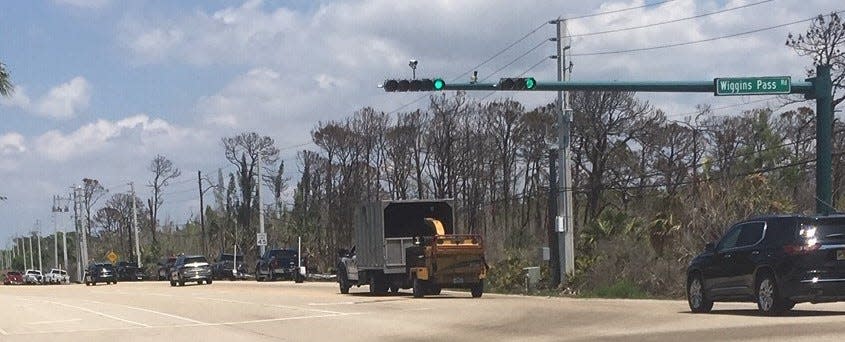 In the Know: Vehicles with boat trailers line up along Vanderbilt Drive in front of where the Kinsale Golf is slated and for more than a half-mile from the ramps at Cocohatchee River Park on Saturday April 15, 2023.