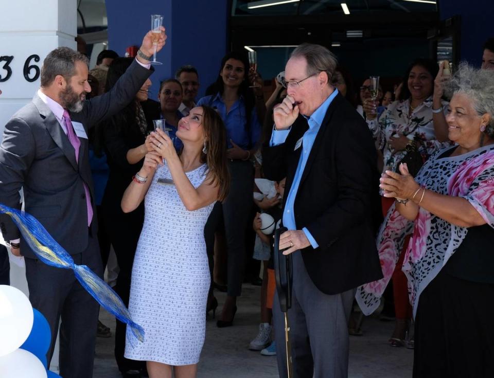 David Centner, left, and Leila Centner, left of center, cut the ribbon at the Centner Academy’s grand opening in the Design District on Aug. 21, 2019.