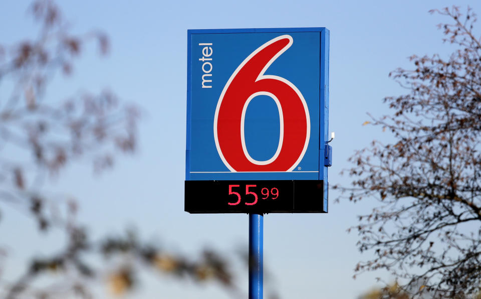 FILE - This Jan. 3, 2018 file photo shows a Motel 6 in SeaTac, Wash. A revised settlement for Motel 6 guests who say the national chain invaded their privacy by giving their information to immigration authorities is returning to court for a judge's review. A federal judge is to decide Friday, July 19, 2019, on the proposal increasing to $10 million the total amount available for claims. (AP Photo/Elaine Thompson, File)