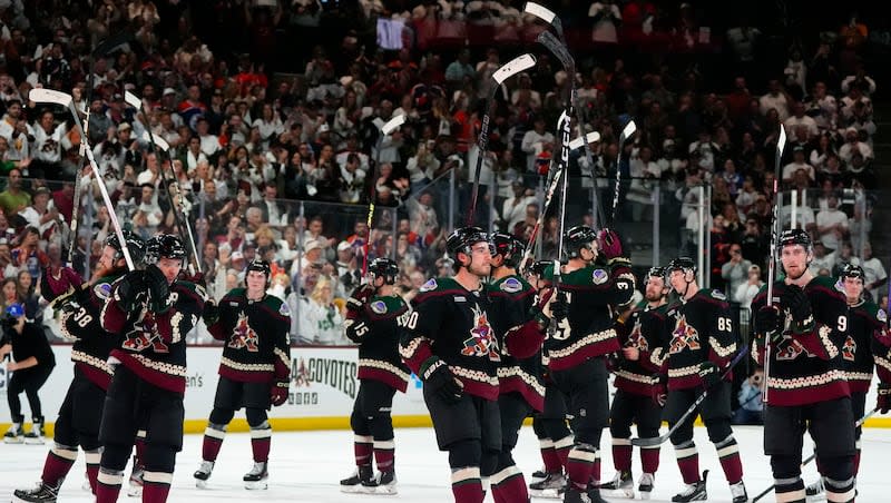 Arizona Coyotes players acknowledge the fans after a game against the Edmonton Oilers on Wednesday, April 17, 2024, in Tempe, Ariz. The Coyotes won 5-2. Team owner Alex Meruelo agreed to sell franchise's hockey operations to Utah Jazz owner Ryan Smith, who intends to move the team to Salt Lake City.