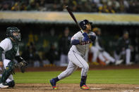 Cleveland Guardians' José Ramírez watches his RBI triple during the ninth inning of the team's baseball game against the Oakland Athletics, Thursday, March 28, 2024, in Oakland, Calif. (AP Photo/Godofredo A. Vásquez)