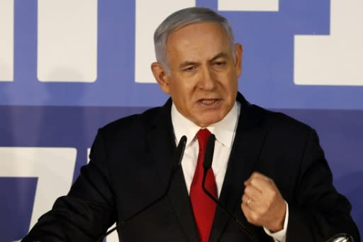 Israeli Prime Minister Benjamin Netanyahu shows characteristic defiance after the attorney general announces he intends to charge him with bribery, fraud and breach of trust, blaming a "witch hunt" by his political opponents