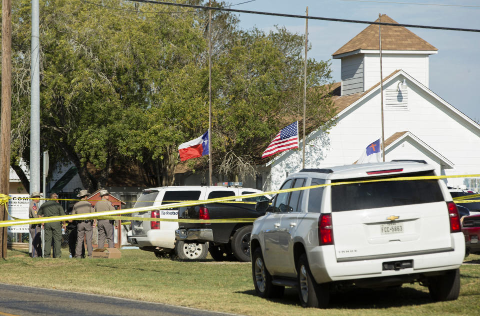 Law enforcement officials gather near the First Baptist Church. (Photo: Erich Schlegel/Getty Images)