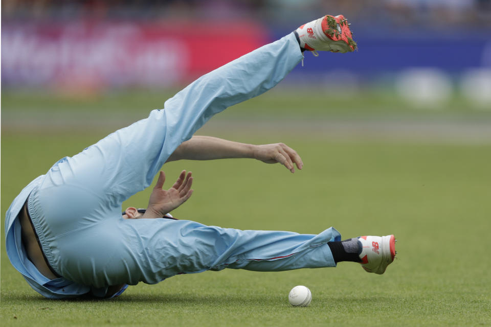 England's Mark Wood fails to hold a catch that would have taken the wicket of West Indies' Chris Gayle during the Cricket World Cup match between England and West Indies at the Hampshire Bowl in Southampton, England, Friday, June 14, 2019. (AP Photo/Matt Dunham)