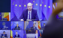 European Council President Charles Michel, top of screen, takes part in an EU Summit, via videoconference link, at the European Council building in Brussels, Thursday, Feb. 25, 2021. European Union leaders are gathering Thursday, via videoconference link, to try to inject new energy into the 27-nation bloc's lagging coronavirus vaccination effort as concern mounts that new variants might spread faster than authorities can adapt. (Olivier Hoslet, Pool via AP)