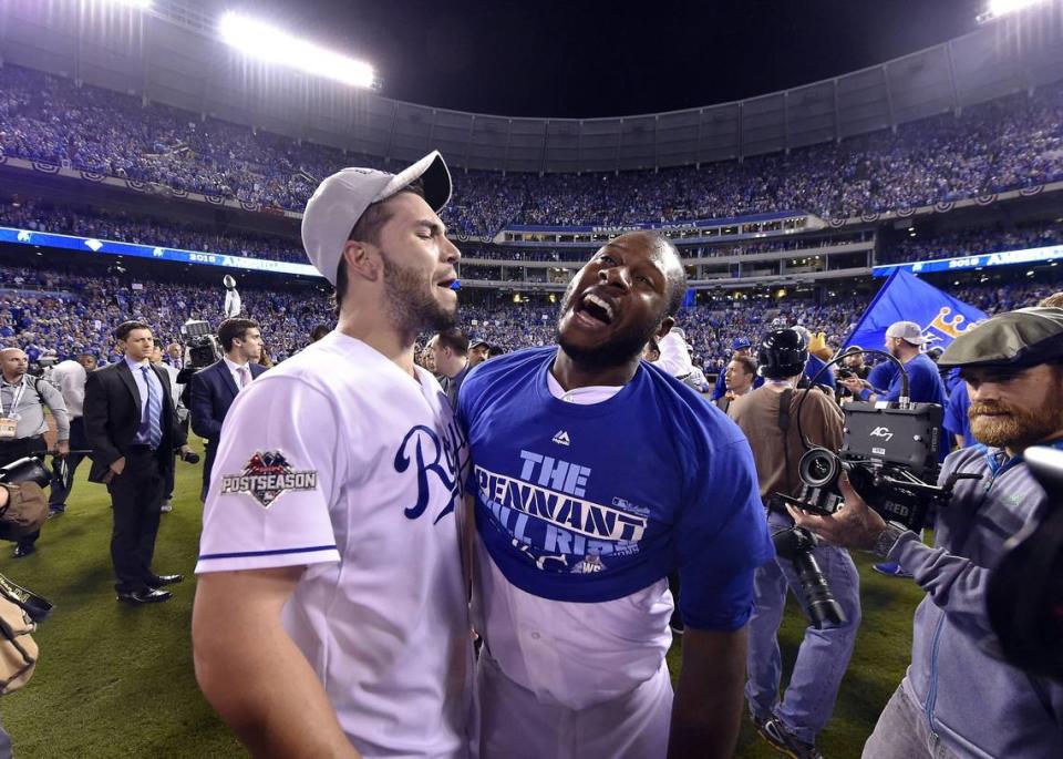 Kansas City Royals first baseman Eric Hosmer, left, and center fielder Lorenzo Cain celebrate after the Royals won the ALCS championship by defeating the Toronto Blue Jays Friday, October 23, 2015 at Kauffman Stadium in Kansas City, Mo.