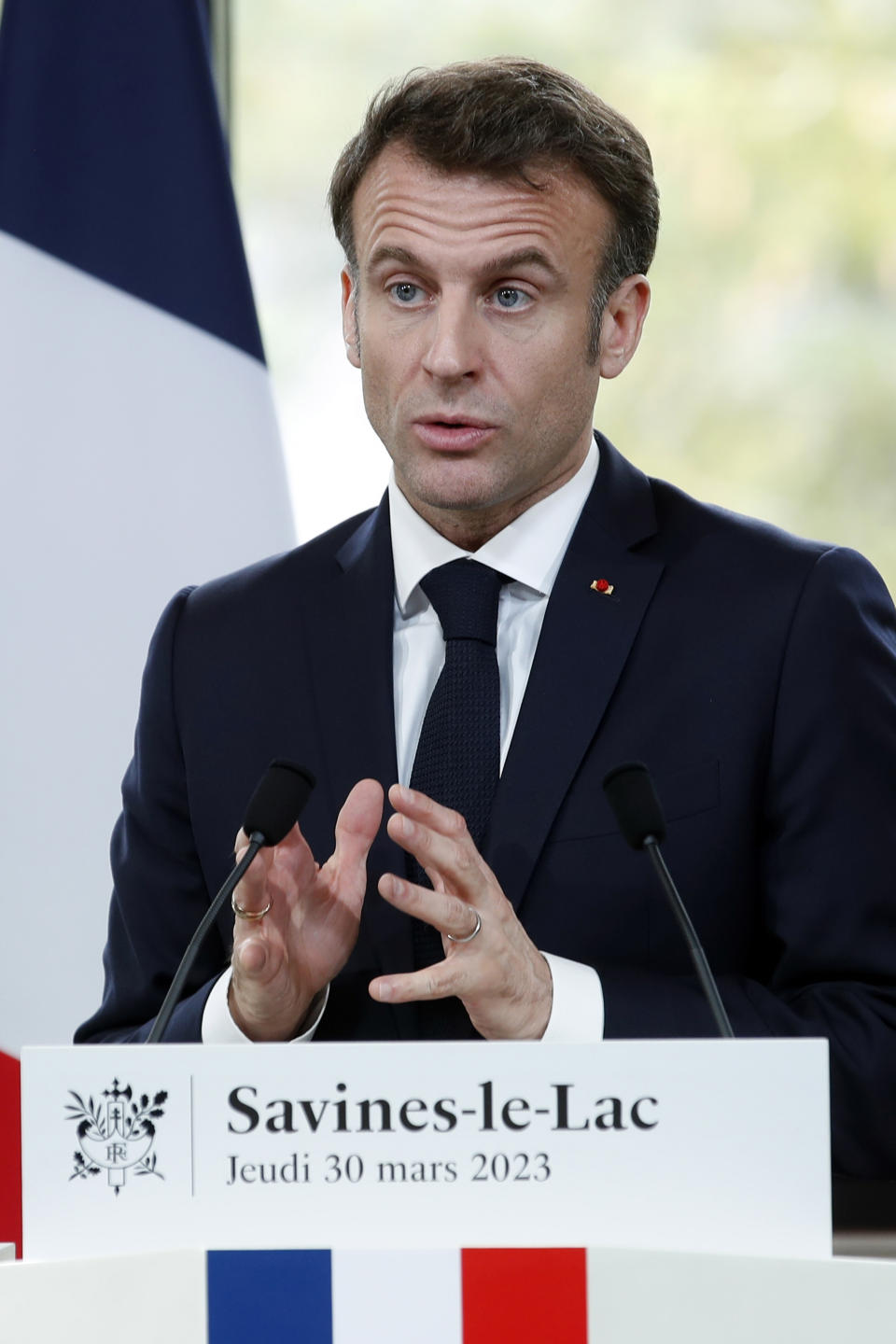 French President Emmanuel Macron delivers a speech in Sainte-Savine-Le-Lac, southeastern France, Thursday, March 30, 2023. Emmanuel Macron presented a plan for saving France's water after exceptional winter drought, February wildfires and violence between protesters and police over an agricultural reservoir. (Sebastien Nogier, Pool via AP)