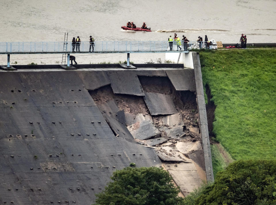 Part of the dam wall of the Toddbrook Reservoir had completely broken away flooding Whaley Bridge. Source: AAP