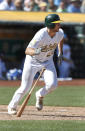 Oakland Athletics' Matt Olson runs after hitting a single against the Minnesota Twins during the sixth inning of a baseball game in Oakland, Calif., Sunday, Sept. 23, 2018. (AP Photo/Tony Avelar)