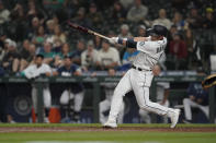 Seattle Mariners' Jake Bauers hits a go-ahead solo home run against the Minnesota Twins during the eighth inning of a baseball game, Monday, June 14, 2021, in Seattle. (AP Photo/Ted S. Warren)