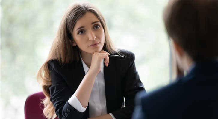 A financial advisor listens to a prospective client during a complimentary consultation. 