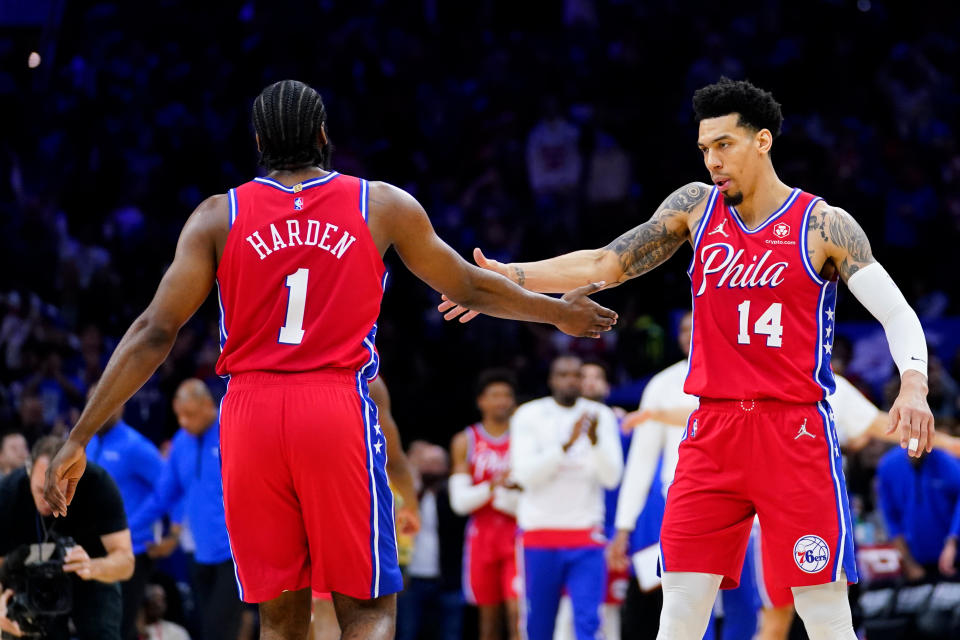 Philadelphia 76ers' James Harden (1) and Danny Green celebrate during the first half of Game 4 of an NBA basketball second-round playoff series against the Miami Heat, Sunday, May 8, 2022, in Philadelphia. (AP Photo/Matt Slocum)