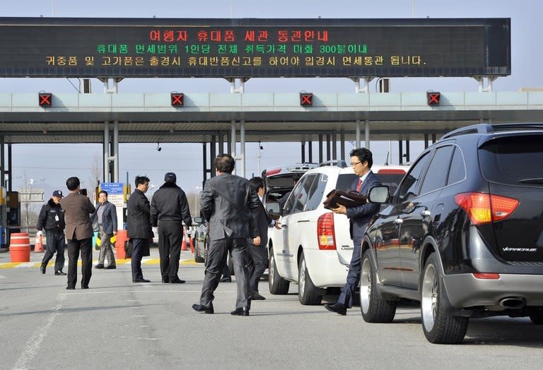 South Korean businessmen wait at the inter-Korean transit office in Paju for permission to deliver food to Kaesong on April 17, 2013. North Korea has barred the South Korean delegation from delivering food and supplies to 200 of their staff inside the closed Kaesong joint industrial zone