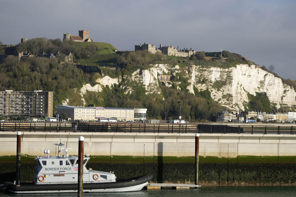 A border force boat sits in in the harbour backdroped by the cliffs of Dover following a small boat incident in the English Channel, in Dover, England, Thursday Nov. 25, 2021. On Wednesday migrants bound for Britain died when their boat sank in the English Channel, in what France's interior minister called the biggest migration tragedy on the dangerous crossing to date. (AP Photo/Kirsty Wigglesworth)