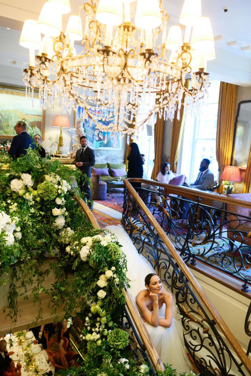 The bride sitting pretty in her custom Zac Posen wedding gown.