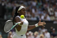 Coco Gauff of the US returns the ball to Amanda Anisimova of the US in a third round women's singles match on day six of the Wimbledon tennis championships in London, Saturday, July 2, 2022. (AP Photo/Alastair Grant)