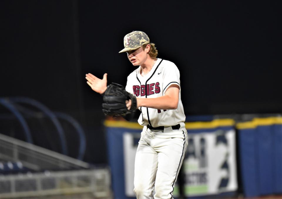 Tate junior pitcher Gabe Patterson celebrates on the mound during the team's 8-3 victory over South Walton on Thursday, March 23, 2023 from Blue Wahoos Stadium.`