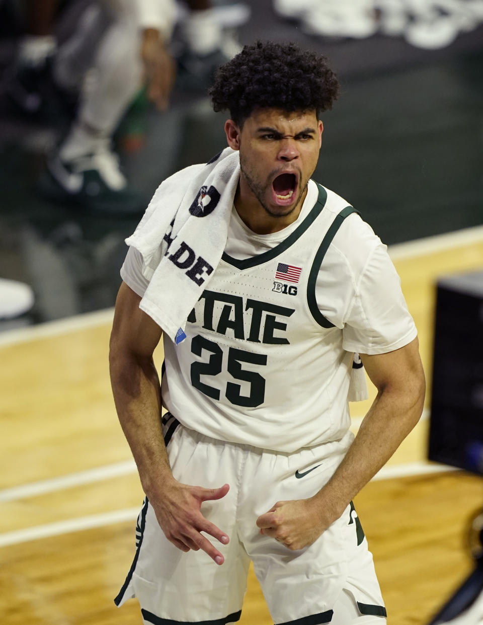 Michigan State forward Malik Hall reacts after a teammate's three-point basket during the first half of an NCAA college basketball game against Michigan, Sunday, March 7, 2021, in East Lansing, Mich. (AP Photo/Carlos Osorio)