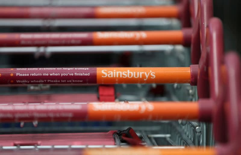 FILE PHOTO: Shopping trolleys at a Sainsbury's store in London