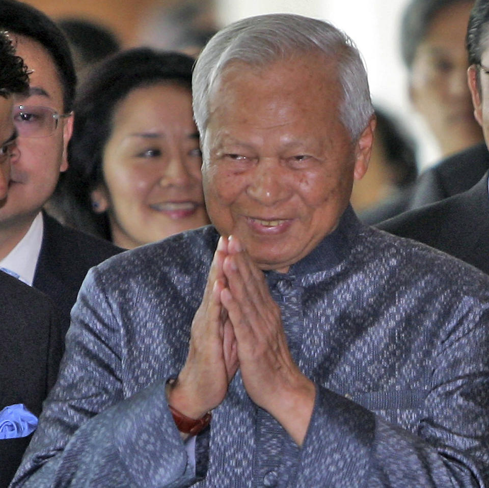 FILE - In this May 26, 2006 file photo, Prem Tinsulanonda, then chief advisor to King Bhumibol Adulyadej greets others on his arrival at the Thailand Ministry of Foreign Affairs in Bangkok. Prem Tinsulanonda, one of Thailand's most influential political figures over four decades who served as army commander, prime minister and adviser to the royal palace, has died at age 98. Thai media reported he died Sunday morning, May 26, 2019, in a Bangkok hospital, and an official announcement is expected. (AP Photo/David Longstreath, File)