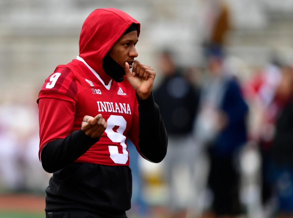 Nov 13, 2021; Bloomington, Indiana, USA;  Indiana Hoosiers quarterback Michael Penix Jr. (9) tries to stay warm before the game against the Indiana Hoosiers at Memorial Stadium. Mandatory Credit: Marc Lebryk-USA TODAY Sports