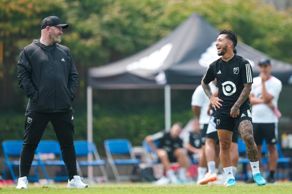 Wayne Rooney and Luciano Acosta, right, speak during MLS All-Star training Tuesday at American University in Washington, D.C.