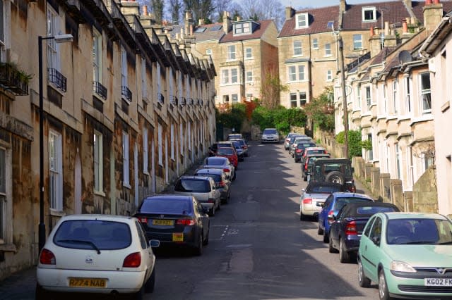 Bath City, UK - March 30 2014: Car parking along the road beside resident houses.Bath is a city in Somerset located in South Wes