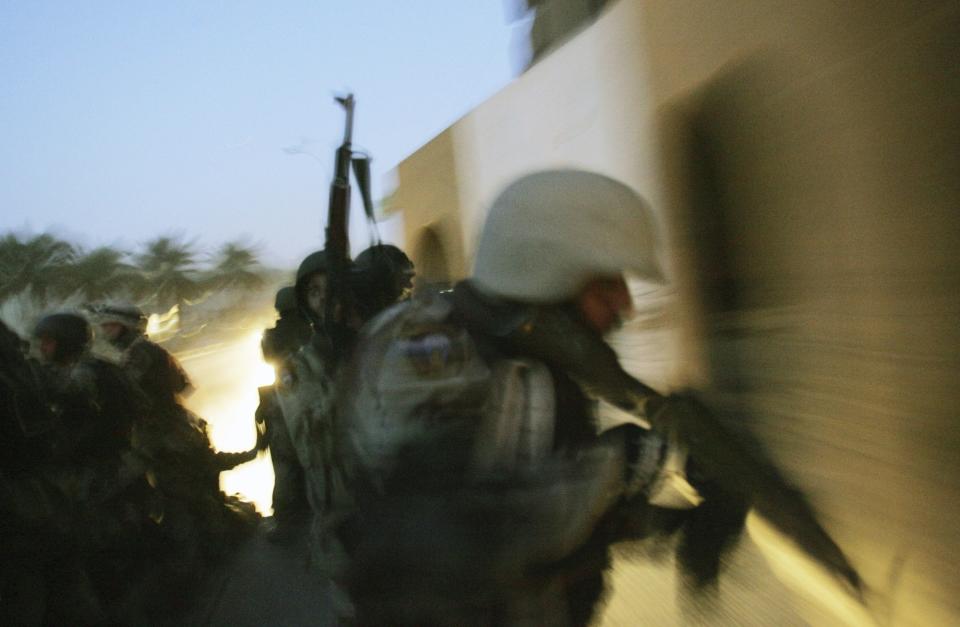 FILE - Iraqi National Guard soldiers patrol the Haifa Street district in Baghdad, Iraq April 11, 2005.(AP Photo/Jerome Delay, File)