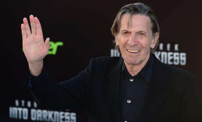 Leonard Nimoy, who played the role of Spock in the original Star Trek television series, gestures on arrival for the Los Angeles premiere of the movie 'Star Trek Into Darkness" in Hollywood, California on May 14, 2013