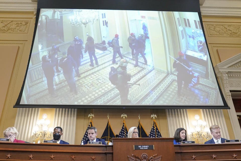 In this U.S. Capitol Police security video, rioters enter the Capitol in a video displayed as the House select committee investigating the Jan. 6 attack on the U.S. Capitol holds a hearing at the Capitol in Washington, Thursday, July 21, 2022. (AP Photo/Patrick Semansky)