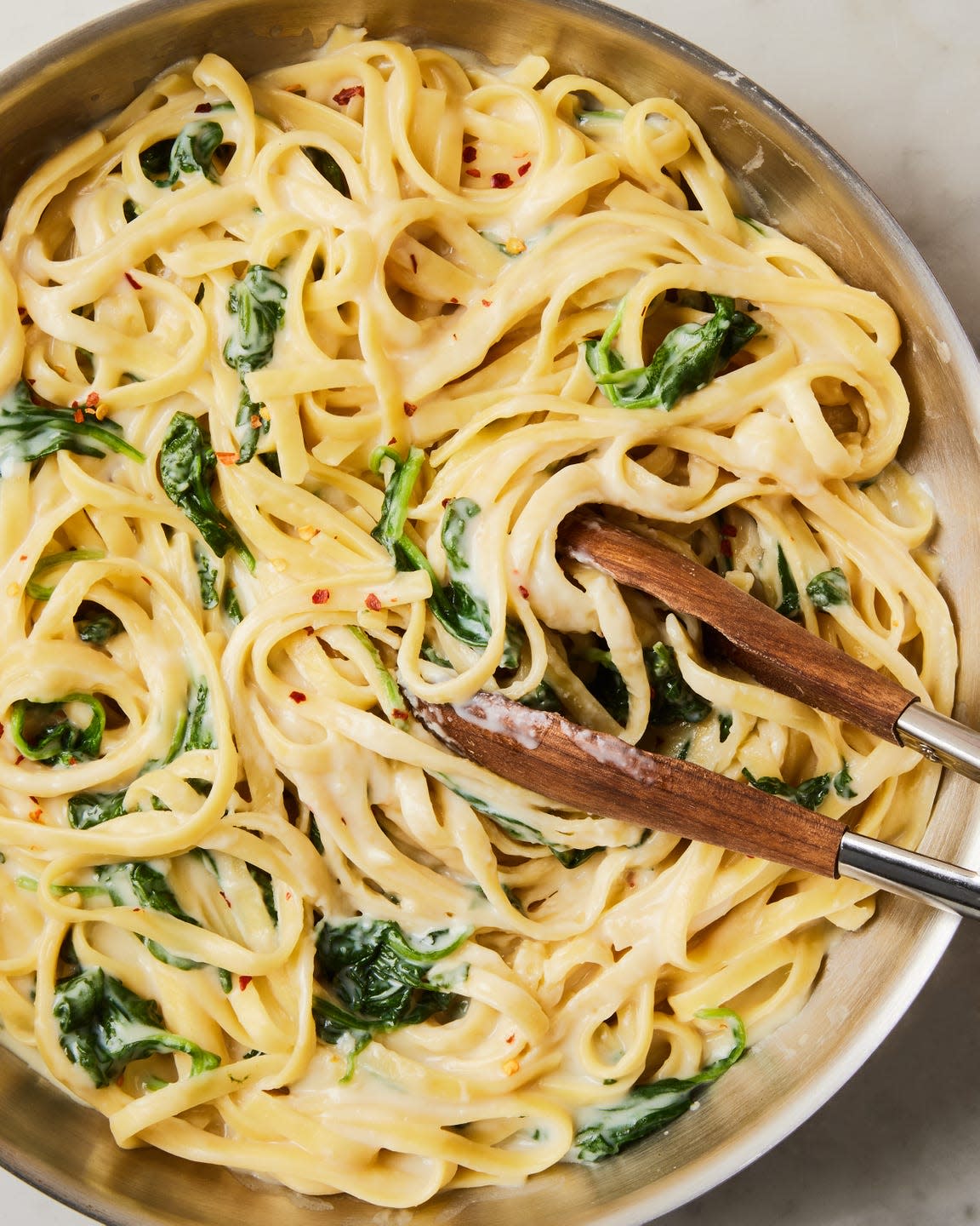 creamy high protein cottage cheese alfredo with spinach and fettuccine